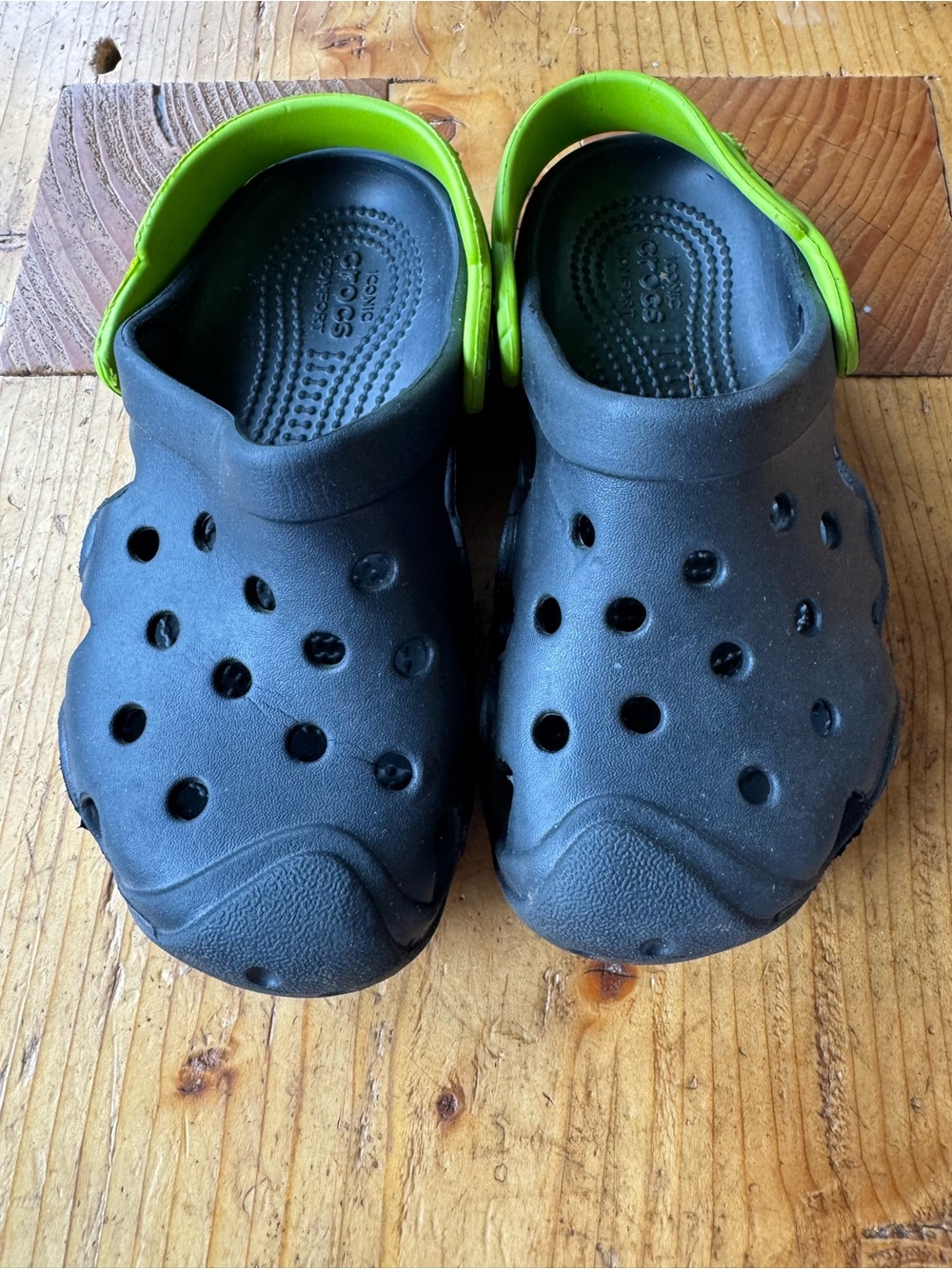 CROCS Kids Black Clogs with Lime Green Heel Strap